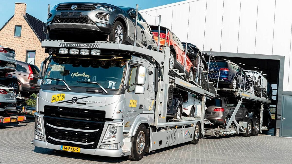 автовоз tesla. экспорт машин. машина для перевозки машин. автовоз вольво lohr. параллельные авто.