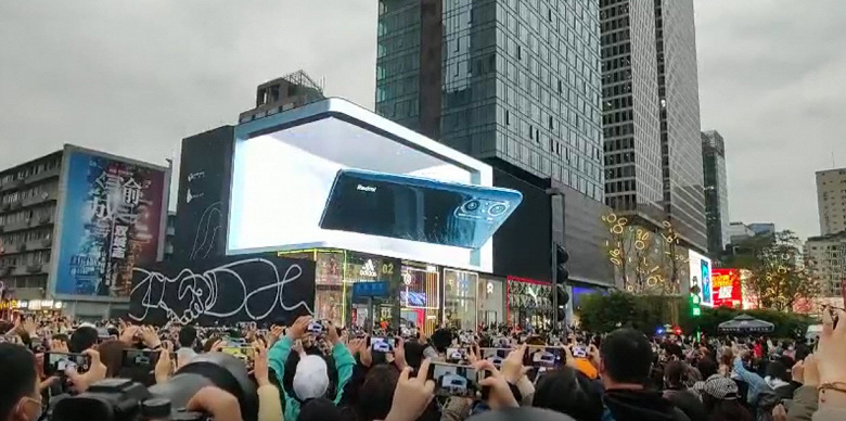 Гигантский Redmi K40 вылетает из фасада здания: реалистичная 3D-реклама нового смартфона