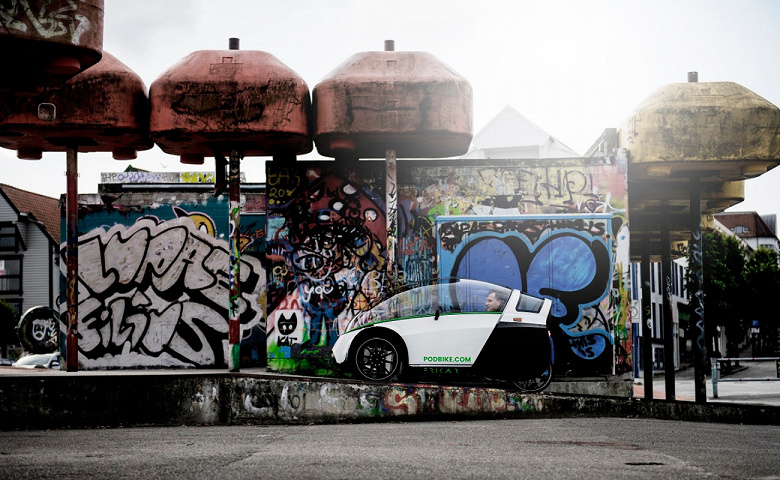 The first electric bike-car is introduced.  He is in great demand