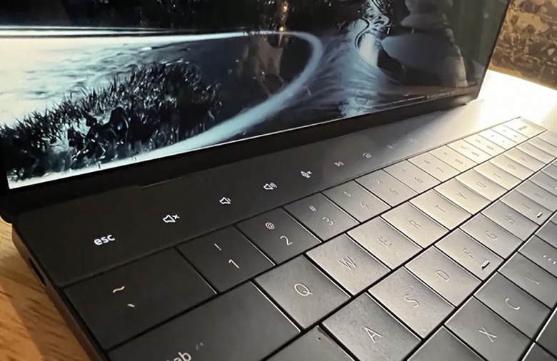 An unusual laptop without a separate touchpad and with an Apple Touch Bar analog.  Dell XPS 13 Plus introduced