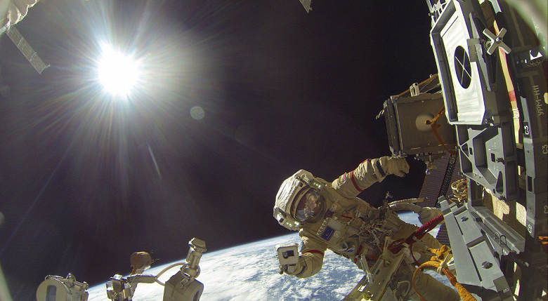 Record-breaking spacewalk from the ISS caught a selfie